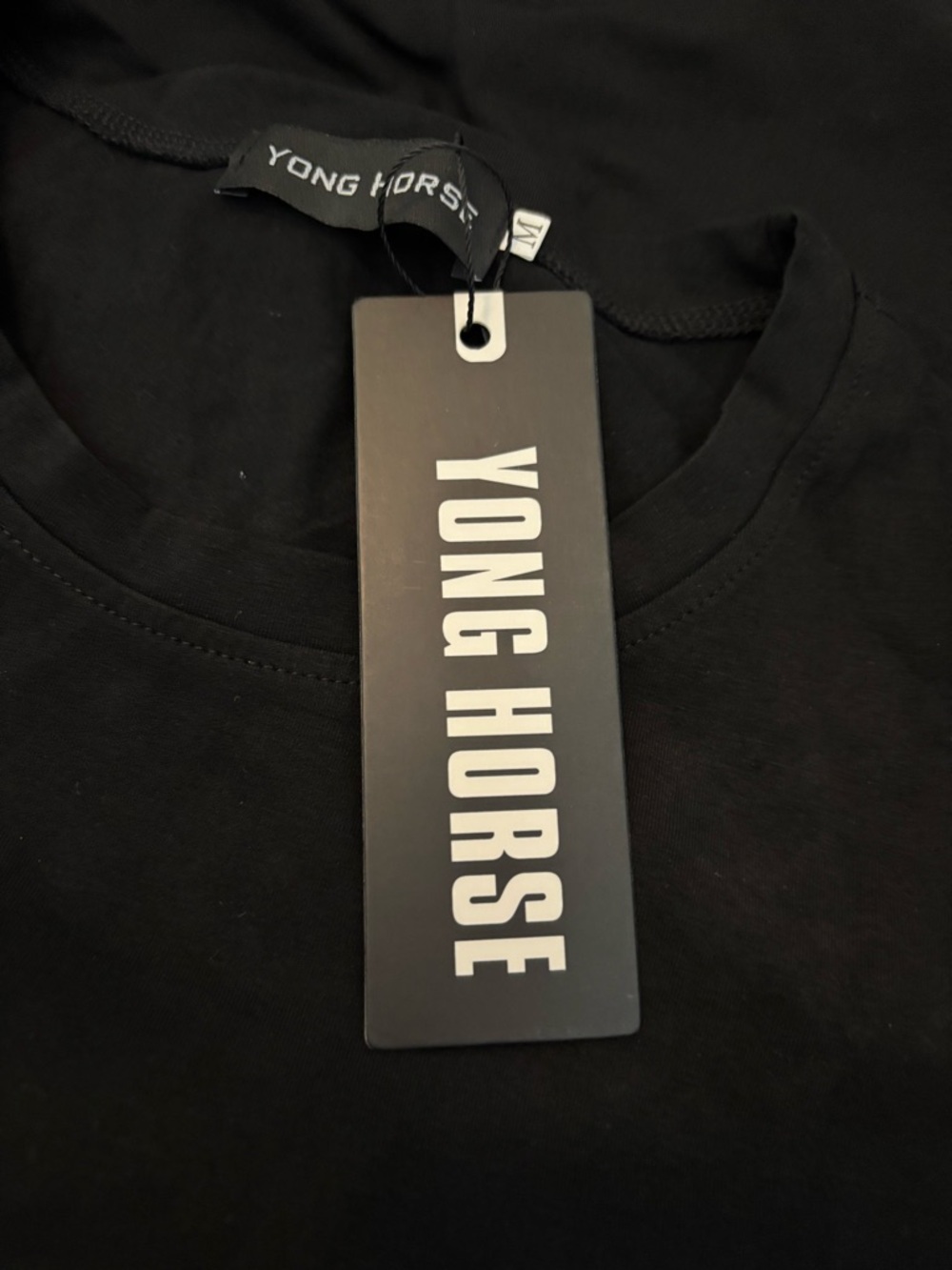 Yong Horse Black Tee with Brand Tag